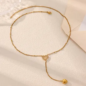 Gold Y-shaped necklace for women, dainty layered heart pendant with crystal, elegant sweater chain.