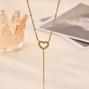 Elegant gold plated Y-shaped necklace featuring a shimmering crystal paved heart pendant.