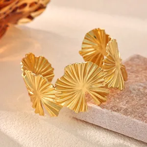 Gold pleated ginkgo leaf cuff bracelet, elegant open geometric minimalist wrist jewelry.