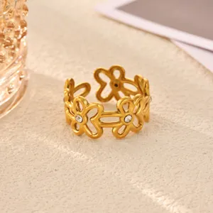 Stainless steel gold plated flower ring for women, minimalist geometric fashion jewelry accessory.