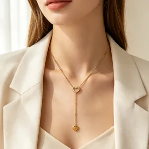 Elegant gold heart y-necklace with sparkling rhinestone pendant for stylish women.