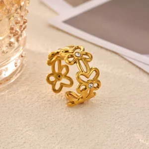 Gold stainless steel hollow flower ring with sparkling rhinestones, minimalist chic fashion jewelry for women.