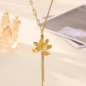 Gold flower pendant Y-chain necklace detail view showing exquisite metal craftsmanship and delicate tassels.