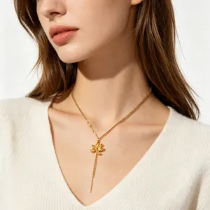 Exquisite gold sunflower Y-necklace detail showcasing delicate floral pendant and chain layer.