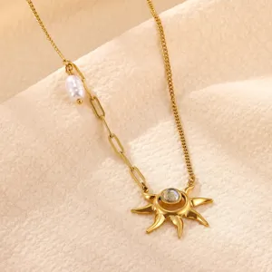 Detailed view of gold stainless steel sun pendant necklace with elegant pearl charm.