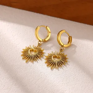 Exquisite gold sunburst hoop earrings with hollow heart design, vintage French elegant jewelry.