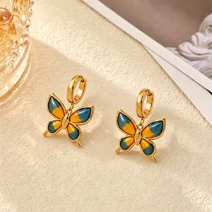 Blue yellow enamel butterfly drop earrings detail shot golden stainless steel hoop jewelry