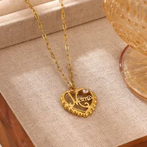Detailed view of 18k gold plated stainless steel heart mom zircon pendant necklace.