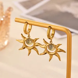 Gold sunburst drop earrings, French retro style fashion jewelry variant for women.