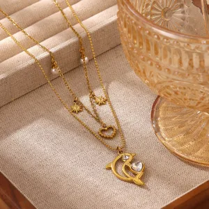 Exquisite multi-layer gold-plated stainless steel necklace with sparkling dolphin and heart pendant.