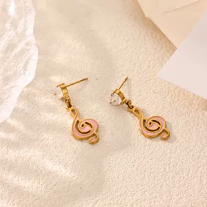 Gold stainless steel treble clef earrings with pink enamel and cubic zirconia detail