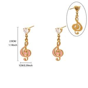 Gold treble clef drop earrings with heart crystal and pink enamel, elegant jewelry.
