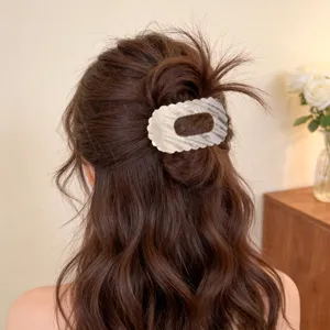 Elegant pearl silver hair claw clip for women, hollow oval seashell hair accessory back head styling.