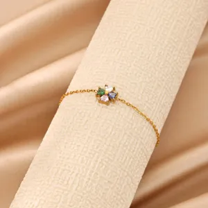 Exquisite 18k gold plated stainless steel clover bracelet featuring colorful heart zircon.