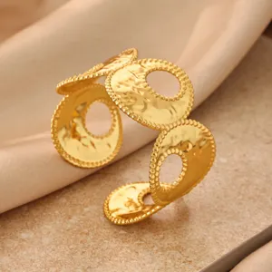 Gold geometric open cuff bracelet with textured hammered metal design for women fashion.