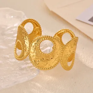 Gold geometric cuff bracelet with hammered texture and elegant beaded edges for women daily wear.