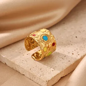 Gold-plated stainless steel ring featuring colorful enamel and textured stylish design.