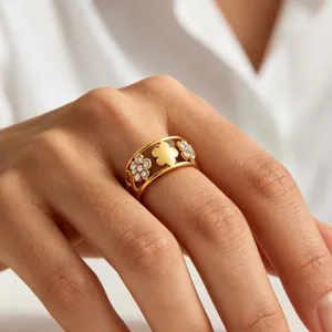 Gold-plated stainless steel flower ring featuring geometric clover designs and sparkling cubic zirconia stones.
