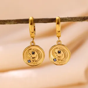 Gold-plated stainless steel star and moon celestial hoop earrings with sparkling blue zirconia stones.
