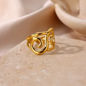Detailed close-up shot of the elegant gold-plated stainless steel geometric swirl open ring.