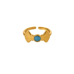 Detail view of a trendy 18k gold plated stainless steel dopamine open ring with blue enamel shell bow.