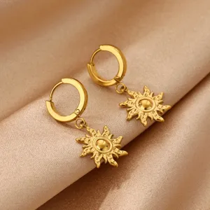 Detailed view of 18k gold plated stainless steel hoop earrings featuring charming sun pendant.
