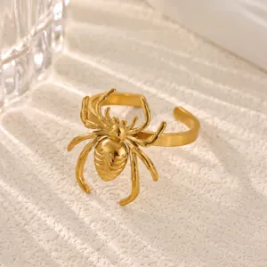 Gold spider open ring detail close up, textured stainless steel fashion jewelry for women.