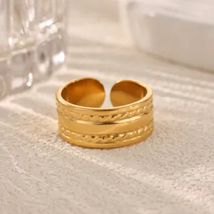 Close-up detail shot of the gold stainless steel ring with retro layered braided geometric design.