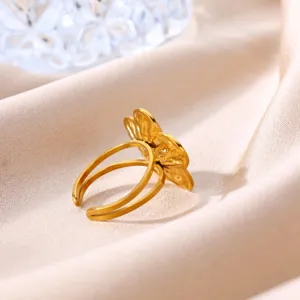 Gold stainless steel sunflower flower ring close-up view, elegant women jewelry detail.
