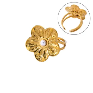 Gold plated stainless steel retro sunflower ring featuring a pearl center, close up detail view.
