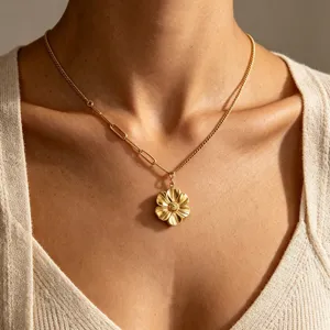 Close-up shot of the elegant gold sunflower pendant necklace showcasing fine metallic texture.