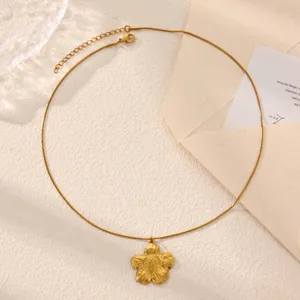 Gold sunflower pendant necklace detail, featuring a delicate chain and textured floral charm.