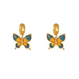 Gold plated butterfly hoop earrings with blue and orange enamel dangle design for women.