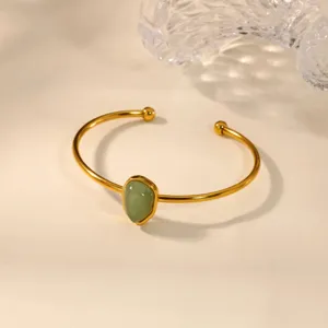Gold stainless steel open bangle bracelet with green synthetic jade drop for women chic.