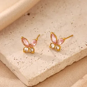 Detail shot of exquisite 18k gold plated stainless steel pink butterfly zircon stud earrings.