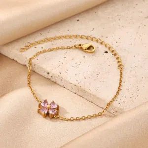 Charming gold plated stainless steel pink zircon four leaf clover bracelet jewelry detail.