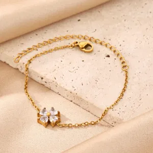 Gold plated stainless steel four leaf clover zircon bracelet close up jewelry detail view