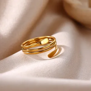 Close-up detail of the elegant minimalist multi-layer gold stainless steel open ring.