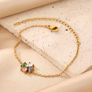 Gold-plated stainless steel multi-color cubic zirconia four leaf clover charm bracelet for women.
