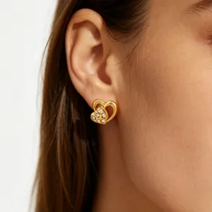 Gold double heart stud earrings with sparkling pavé crystals elegant detail accessory for women