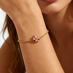 Gold plated stainless steel pink cubic zirconia four leaf clover bracelet detail view