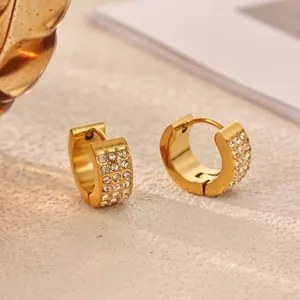 Gold-tone chunky huggie hoop earrings featuring sparkling pavé crystals for women daily wear