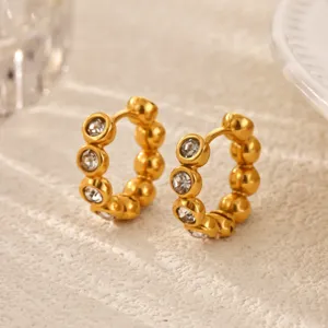 Gold-plated hoop earrings with sparkling rhinestones and beaded detail for daily wear.