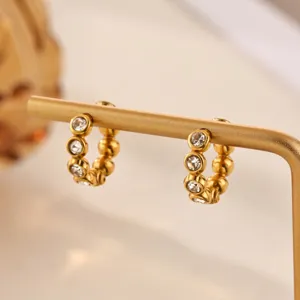Elegant gold-tone crystal beaded hoop earrings detailed close-up view fashion jewelry item