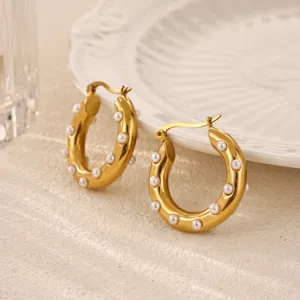 Elegant gold-plated hoop earrings featuring delicate pearl embellishments for daily wear.