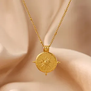 Exquisite 18k gold plated stainless steel compass flower pendant necklace, detailed texture.