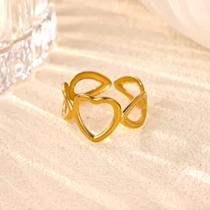 Gold stainless steel hollow heart open ring detail shot, stylish daily jewelry accessory.