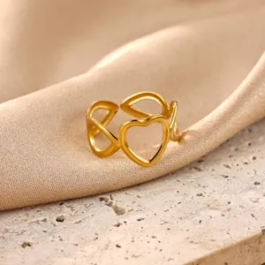Gold-plated stainless steel open ring with hollow heart detail, delicate jewelry accent.