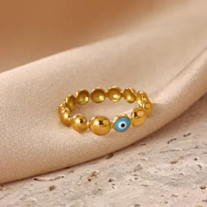 Detailed view of the 18k gold plated stainless steel evil eye bead ring, minimalist design.