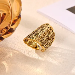 Detailed view of wide gold mesh open ring, stylish stainless steel jewelry for women.